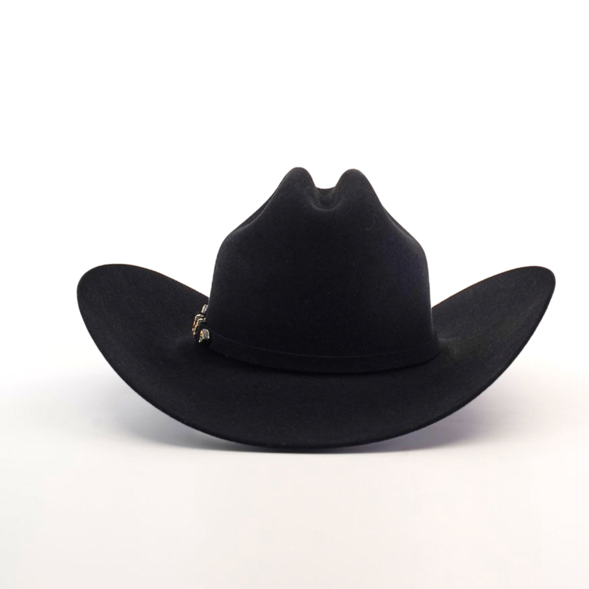 The 10X Jerarca Black is a handcrafted black cowboy hat made from fur felt, with a wide brim and distinctive top crease. It features a small decorative band on one side, exemplifying classic western headwear against a plain white background.