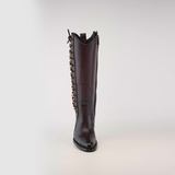 The Francia Rings Tall Shaft Chocolate - J Toe boot is made from premium leather, standing tall in dark brown. This luxury boot features decorative chain links on the side and a small loop at the top for easy wear.