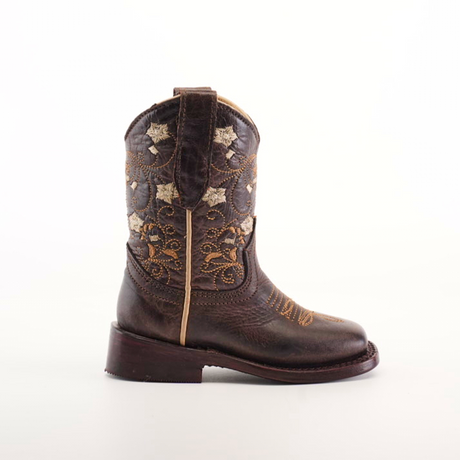 A single Dariela Chocolate - Square Toe brown cowboy boot is crafted from premium leather with intricate golden floral embroidery and star designs. It stands on a plain white background, featuring a thick heel, pull tab, and chic chocolate square toe for added style.