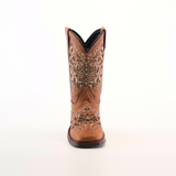 The Kiara Studs Fawn - Square Toe is a single brown cowboy boot crafted from premium leather, showcasing intricate embroidery and decorative stitching on the shaft, viewed from the front against a white background. Ideal for fashion-forward young girls seeking to add a Western flair.