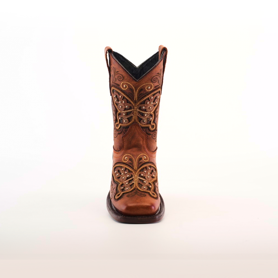 A single brown cowboy boot, crafted from cowhide leather with intricate butterfly embroidery and decorative stitching on the front, is set against a plain white background. This is the Butterfly Studs Cogñac - Square Toe.