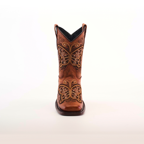 A single brown cowboy boot, crafted from cowhide leather with intricate butterfly embroidery and decorative stitching on the front, is set against a plain white background. This is the Butterfly Studs Cogñac - Square Toe.