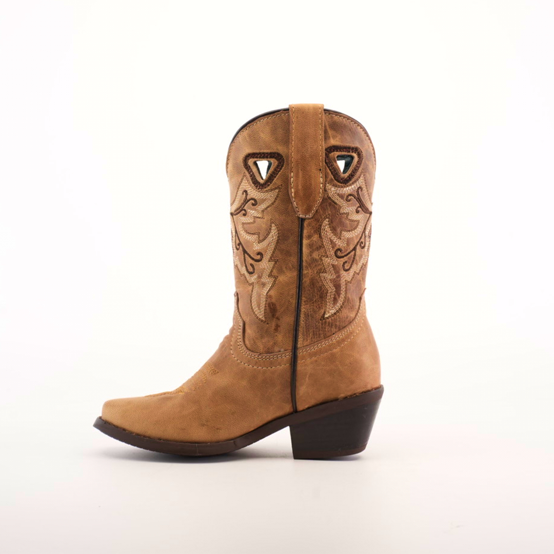 The Matcat Fawn - Snip Toe boot is tan with detailed shaft embroidery, brown stitching, and crafted from premium leather. It features a pull tab, dark brown angled heel, and cutout shapes near the top.