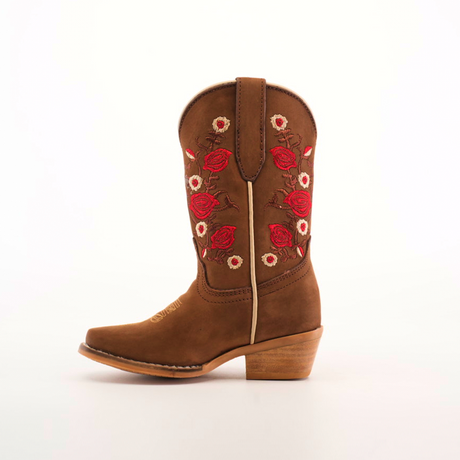 A handcrafted brown cowboy boot with a wooden heel and red and white floral embroidery on the shaft is displayed against a plain white background, similar to the Mia Copper Suede - Snip Toe boots.