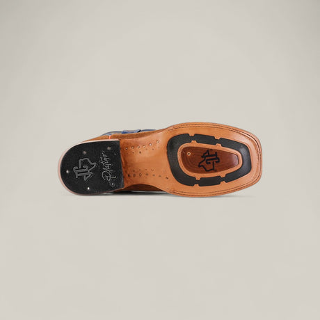 The Buck - Camel - Square Toe mens dress shoe features a tan leather sole with black rubber inserts and signature branding near the heel and center, inspired by classic square toe designs. Photographed on a plain light background.