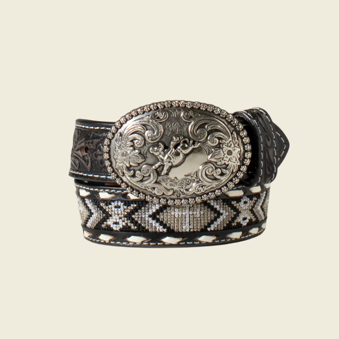 The Nocona Western Belt Boys Cross Inlay Embroidered Laced Black (N4441601) is a black leather belt with a large ornate silver buckle adorned with floral patterns and Western-inspired designs, featuring stitched patterns in black, white, and gray for a rustic touch.