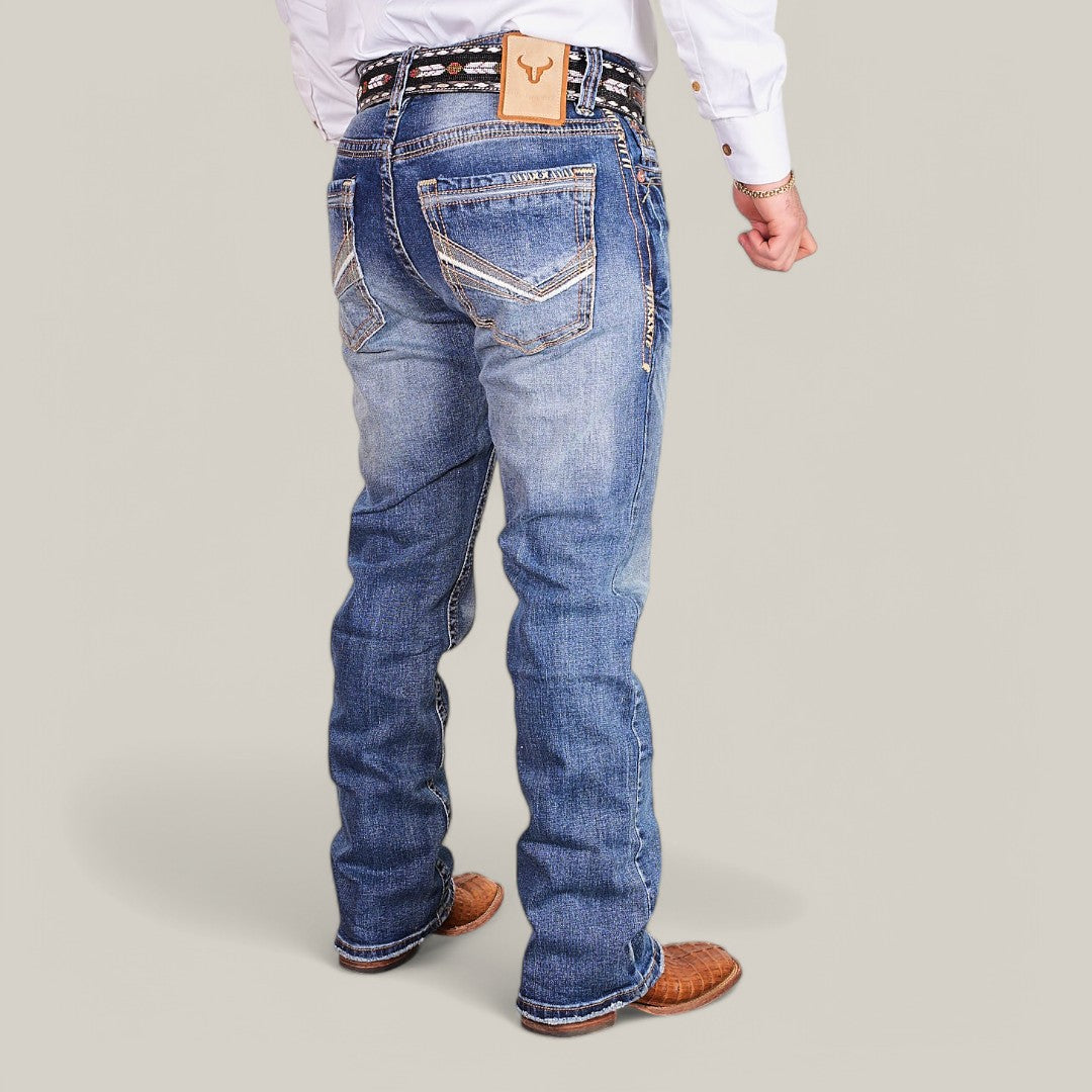 A person is shown from the back wearing Western Blue Straight Fit Embroidered Jeans - W435 with white stitching and a leather waistband label, paired with brown cowboy boots and a white shirt, creating a flattering and effortlessly stylish look.