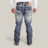 A person wears a white shirt, Western Blue Straight Fit Embroidered Jeans - W431, featuring prominent pocket stitching and distressed details, along with a brown leather belt. They stand against a plain light grey background with their back to the camera, exuding classic style.