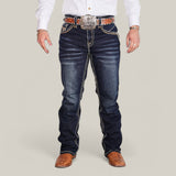 A person in a white shirt, wearing Western Blue Straight Fit Embroidered Jeans - WM367, a large silver belt buckle, and brown textured cowboy boots stands against a plain background.