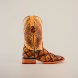 The Big Bass Pirarucu Print Orix - Square Toe cowboy boot features a light tan upper with geometric patterns, a textured brown and tan cowhide leather lower, and comes complete with a wooden sole and heel on a plain, light background.