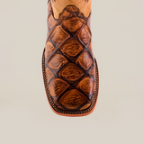 Overhead view of the Big Bass Pirarucu Print Orix - Square Toe boot, crafted from premium cowhide leather with textured brown finish and intricate stitching, against a plain background.