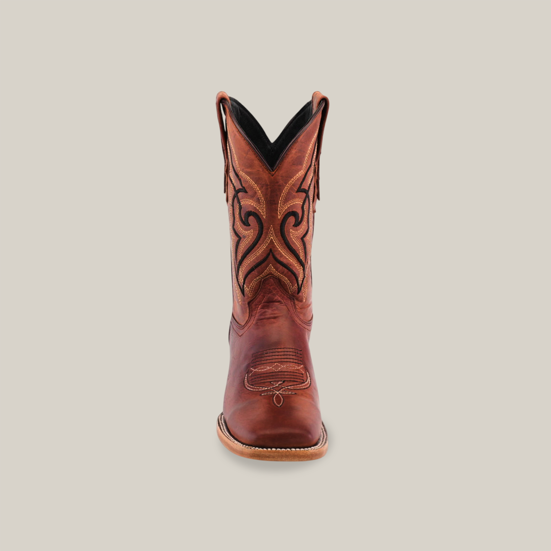 A single brown leather cowboy boot, Fresno Shedron in color, crafted from premium cowhide with intricate black and tan stitching stands upright against a white background. It features a textured sole and square toe design.