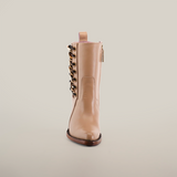 Discover the Francia Rings Bootie Cream - J Toe, made from premium leather with decorative side laces and a back pull tab. Part of our Platinum Collection, it has a flat sole and elegantly stands upright against a plain white background.