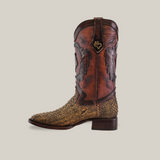 The Exotic Python - 4G - Vintage Honey cowboy boot features a brown and yellow design, embossed leather details, and a textured lower pattern. With a Goodyear welt sole for durability, it includes intricate dark stitching and a logo emblem on the side, all set against a plain white background.