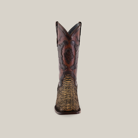 The Exotic Python - 4G - Vintage Honey cowboy boot features a brown and yellow design, embossed leather details, and a textured lower pattern. With a Goodyear welt sole for durability, it includes intricate dark stitching and a logo emblem on the side, all set against a plain white background.