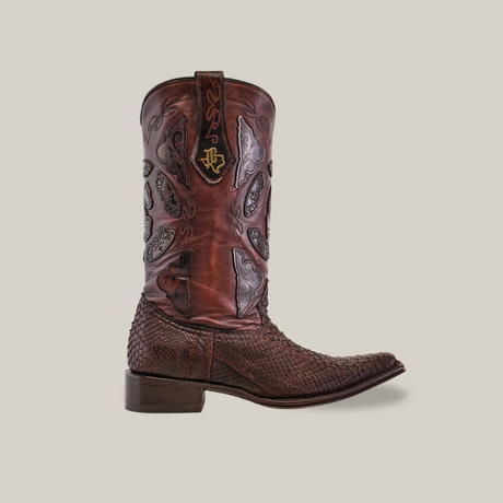 The Exotic Python - 4G Versy Toe boot from the Platinum Collection features an intricate design with a textured lower and decorative crest on the shaft, plus a durable Goodyear welt sole, set against a plain, light background.