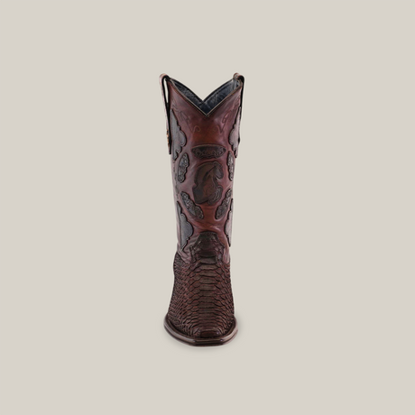 From the Platinum Collection, this single Western-style cowboy boot features intricate black and red patterns. It has a Versy Toe, pull straps on each side, and an Exotic Python - 4G Matte Brown finish over a plain light grey backdrop.