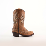 The Kiara Crystals Fawn - Snip Toe is a single brown cowboy boot crafted from premium leather, featuring intricate embroidery and decorative patterns on the shaft and foot. It has a low heel, snip toe, and pull tab at the top, gleaming subtly against the plain white background.