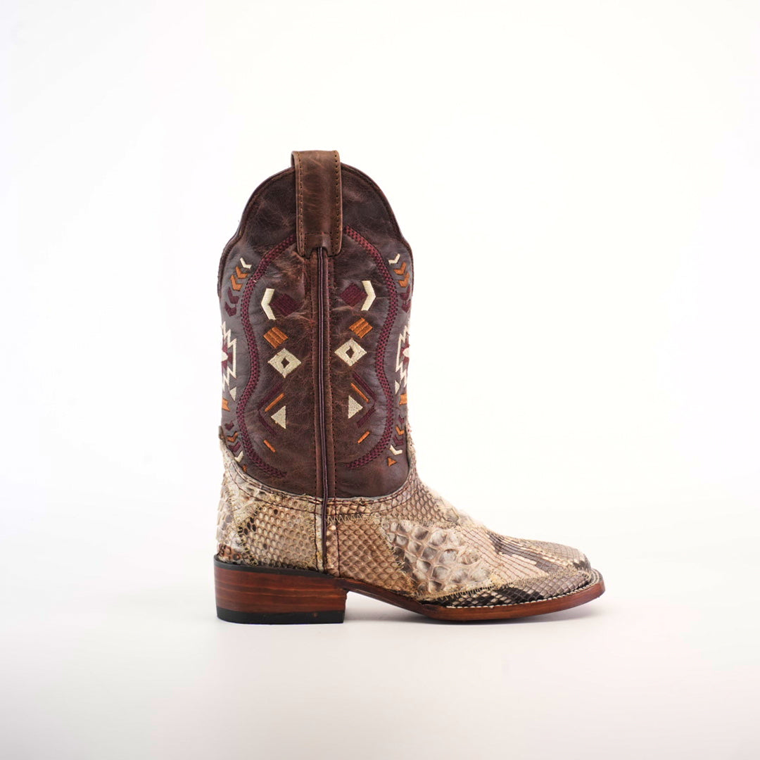 The Exotic Python Patchwork boot showcases a brown upper with embroidered geometric designs and premium light python leather lower. It features a natural square toe, flat wooden heel, and structured design, all set against a plain white background.