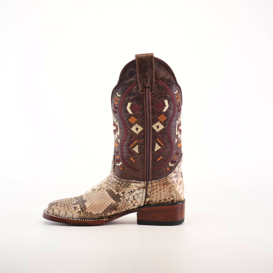 The Exotic Python Patchwork Natural Square Toe boot displays a patterned shaft with geometric red, yellow, and brown designs. Made from premium python leather, the foot has a beige and brown snakeskin texture and features a natural square toe against a plain white backdrop.