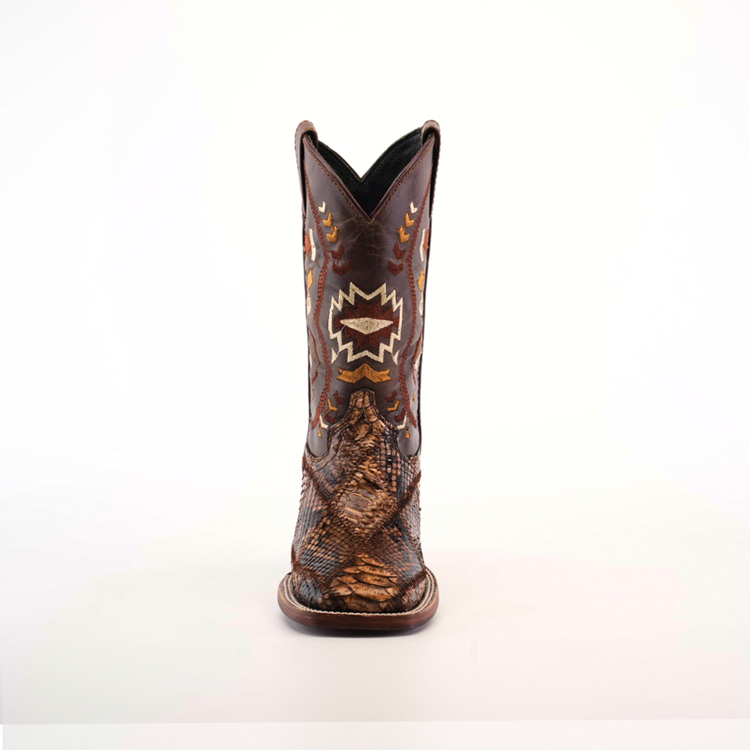 The Exotic Python Patchwork Brown Square Toe boot is crafted from luxurious python leather, featuring intricate stitch patterns and reptilian texture details on the toe and heel. This exotic masterpiece stands upright against a plain white background.