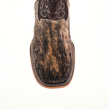 Close-up of the Cowhide Hair Fawn Square Toe boot, featuring a cowhide hair texture in brown and black. The square toe has intricate stitching on the leather upper, complemented by a fawn finish and light brown sole.