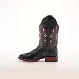 The Exotic American Alligator Patchwork Black Square Toe boot showcases a detailed red, white, and orange embroidered pattern on black leather with an alligator-like texture and wooden heel. Set against a plain white backdrop, it embodies true cowboy style.