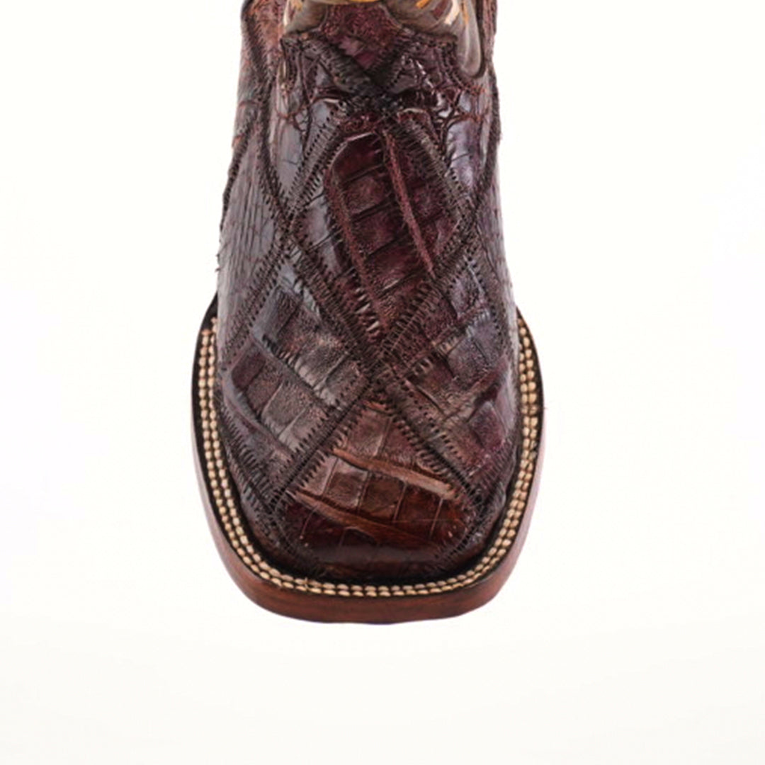 Close-up of an Exotic American Alligator Patchwork Brown Square Toe cowboy boot against a white background, showcasing the genuine alligator skin with intricate stitched patterns and rounded edges.