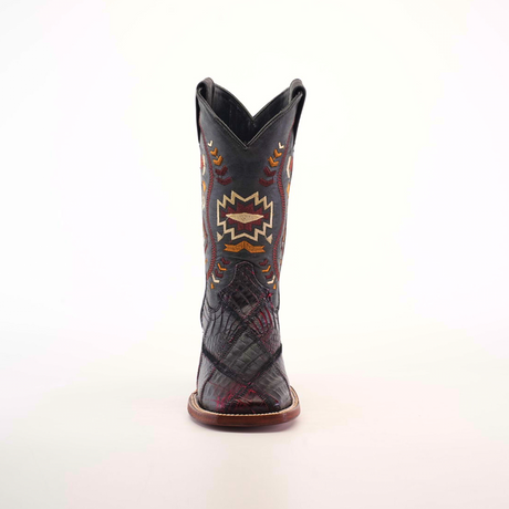 Front view of an Exotic American Alligator Patchwork Black Cherry Square Toe cowboy boot, featuring a black upper with colorful geometric embroidery in orange, red, and yellow hues, and a brown sole that boldly contrasts the textured leather.