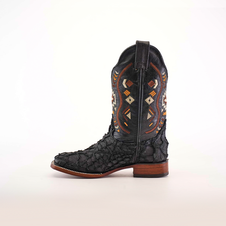 The Exotic Pirarucu Fish Patchwork Matte Black Square Toe boot combines genuine leather with elaborate colorful patterns on the upper shaft. It showcases a textured surface, a wooden sole with stacked heel, and is photographed against a plain white background.