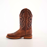 The Fresno Shedron Slip Resistant Sole Rodeo Toe boot is a single brown cowboy boot on a white background, with intricate stitching, a leather pull tab, rodeo toe, wooden heel, and slip-resistant sole for style and function.