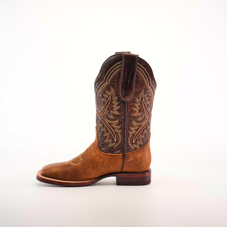 The single brown cowboy boot, featuring detailed stitching and a leather tab on top, showcases exceptional craftsmanship. It resembles the Cater Honey Square Toe boots, crafted from premium leather and set against a white backdrop.