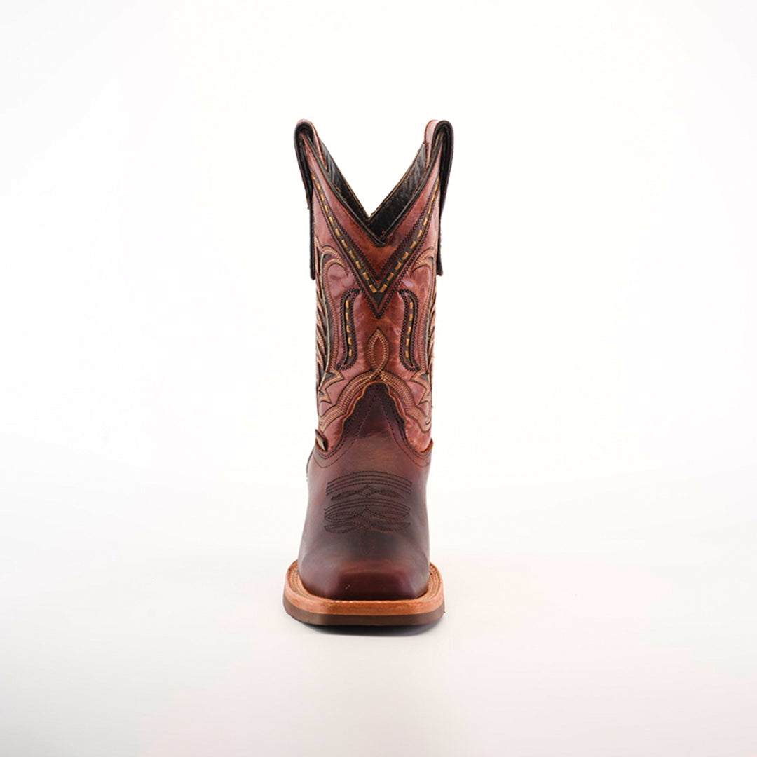 A single Azkar Moka cowboy boot with a pointed rodeo toe is showcased against a white background. It features intricate stitching, a stacked heel, decorative patterns along the shaft, and a slip-resistant sole for added stability.