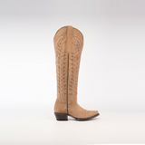 A tall-shaft, snip-toe Madona Sand Suede cowboy boot with intricate stitching is showcased from the side against a plain white background.