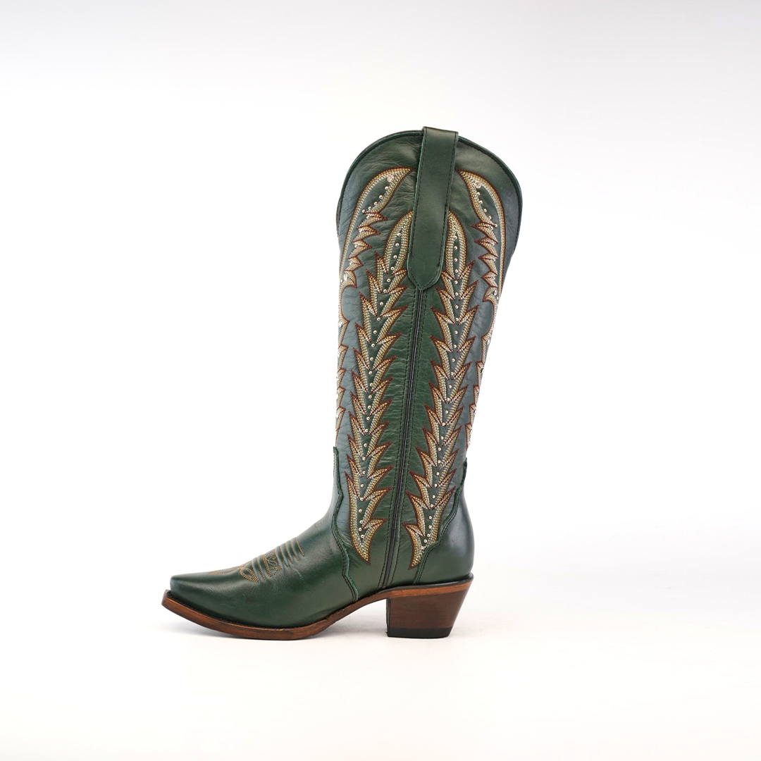 The Madona Forest Green cowboy boot features premium leather with intricate brown stitching on the tall shaft, a snip toe, and a mid-height heel, all displayed against a plain white background.