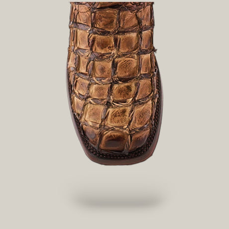 Close-up of the Asturias Honey Fish Pirarucu Laser & Woven (CU658), a luxurious square-toe shoe made from Pirarucu fish leather, featuring an embossed crocodile texture and intricate scale pattern.