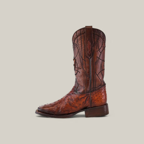 The Moroni Chestnut Ostrich Laser & Embroidery - Square Toe (CU457) boot features intricate laser and embroidery designs on brown leather, highlighted by a slightly pointed toe and sturdy heel, set against a plain light gray background.