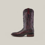 A dark brown cowboy boot features intricate embroidery on the shaft and a textured Lisboa Cherry Python design with a square toe.