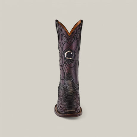 Front view of a black cowboy boot with intricate embroidery and a crescent moon on the shaft. Its wide, round toe and stitched leather sole stand out against a beige backdrop, capturing the rugged elegance of Lisboa Cherry Python Embroidery & Laser & Woven - Square Toe - CU746 boots.