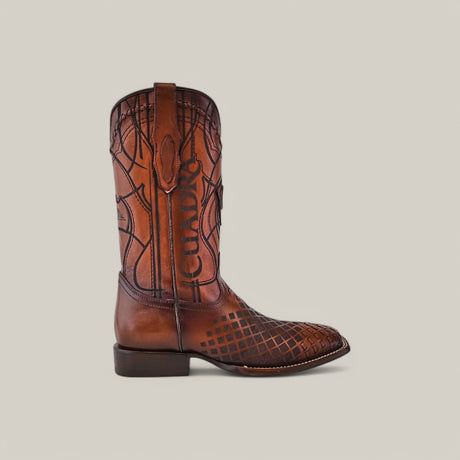 The Over Honey Laser & Embroidery & Woven - Square Toe - CU500 cowboy boot showcases intricate embroidery and decorative patterns on the shaft and toe, complemented by a square toe and low heel, all set against a plain light gray background.