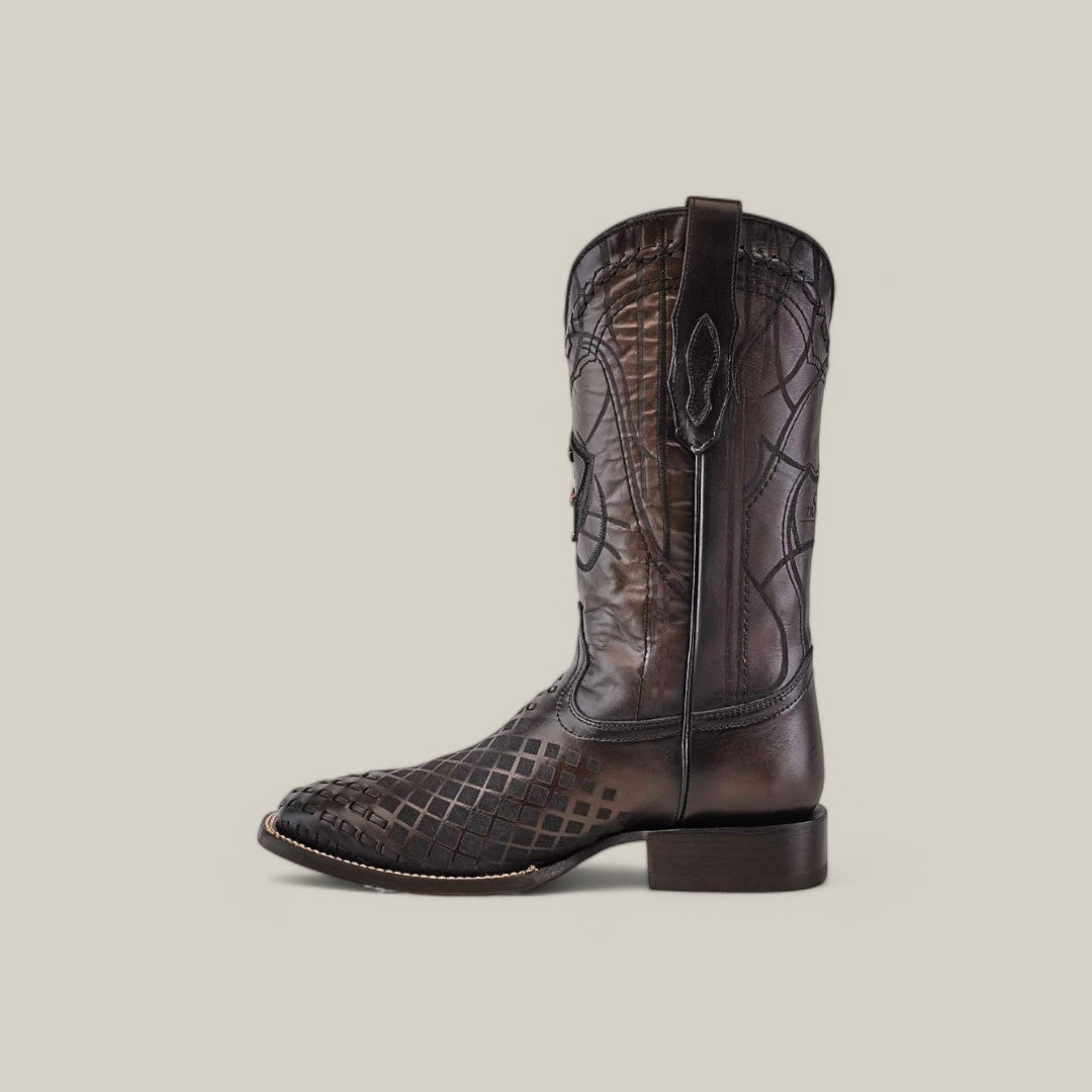 A single Over Black Laser & Embroidery & Woven cowboy boot (CU676) with intricate embroidery and embossed patterns, featuring a square toe and a low heel, displayed against a plain beige background.