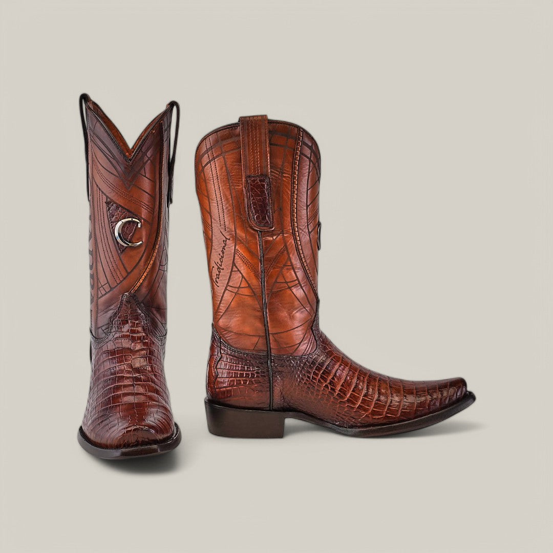 The Brown Moreletii Laser & Embroidery boots (CU700) feature rich brown alligator leather, with one boot upright and the other angled to showcase detailed patterns, stitching, and laser-engraved accents against a light gray background.