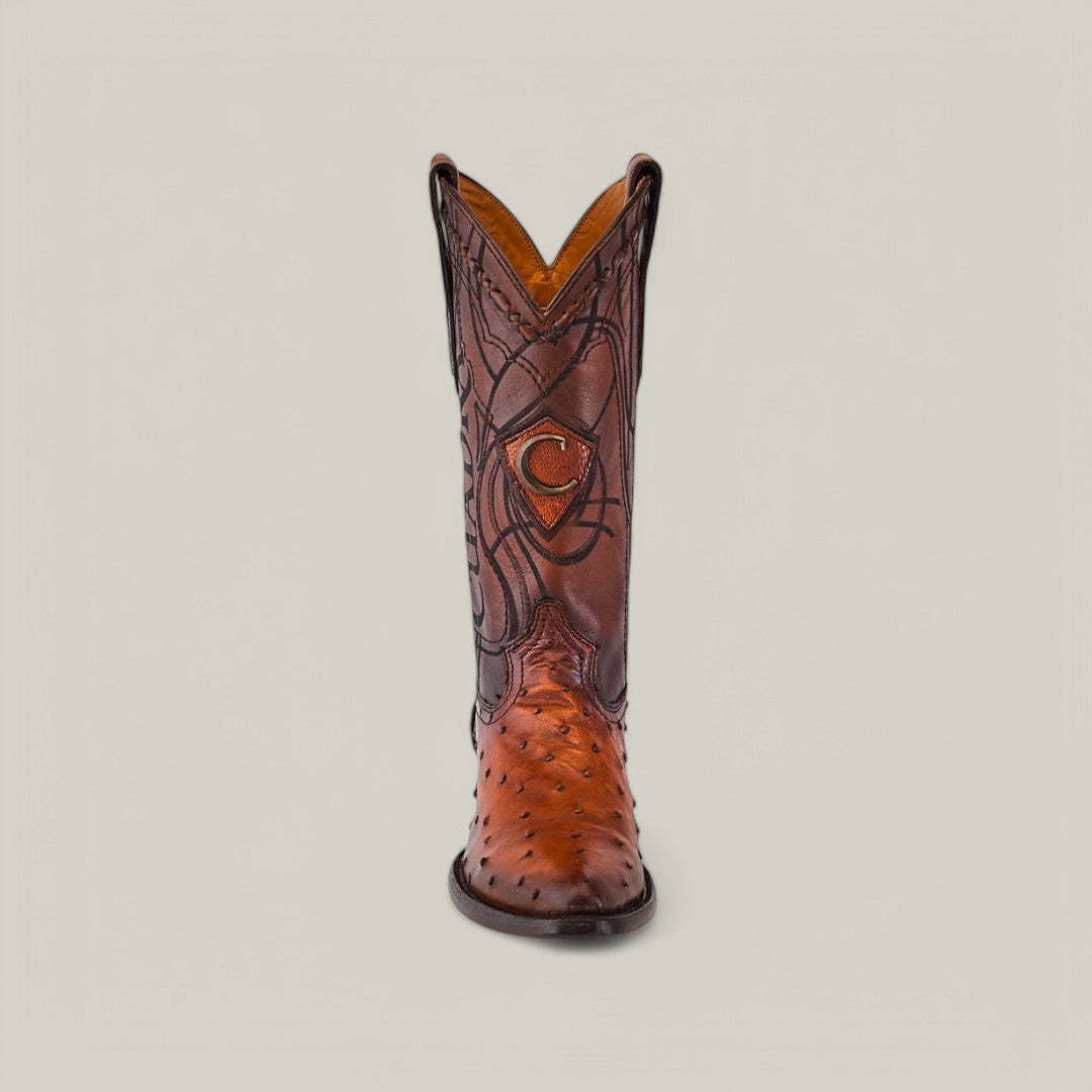 The Moroni Chestnut Ostrich Laser & Embroidery Round Toe CU303 displays exquisite craftsmanship in a single brown boot made from luxurious ostrich leather, featuring intricate shaft stitching and distinctive patterns. Its tall design stands out beautifully against a neutral background.