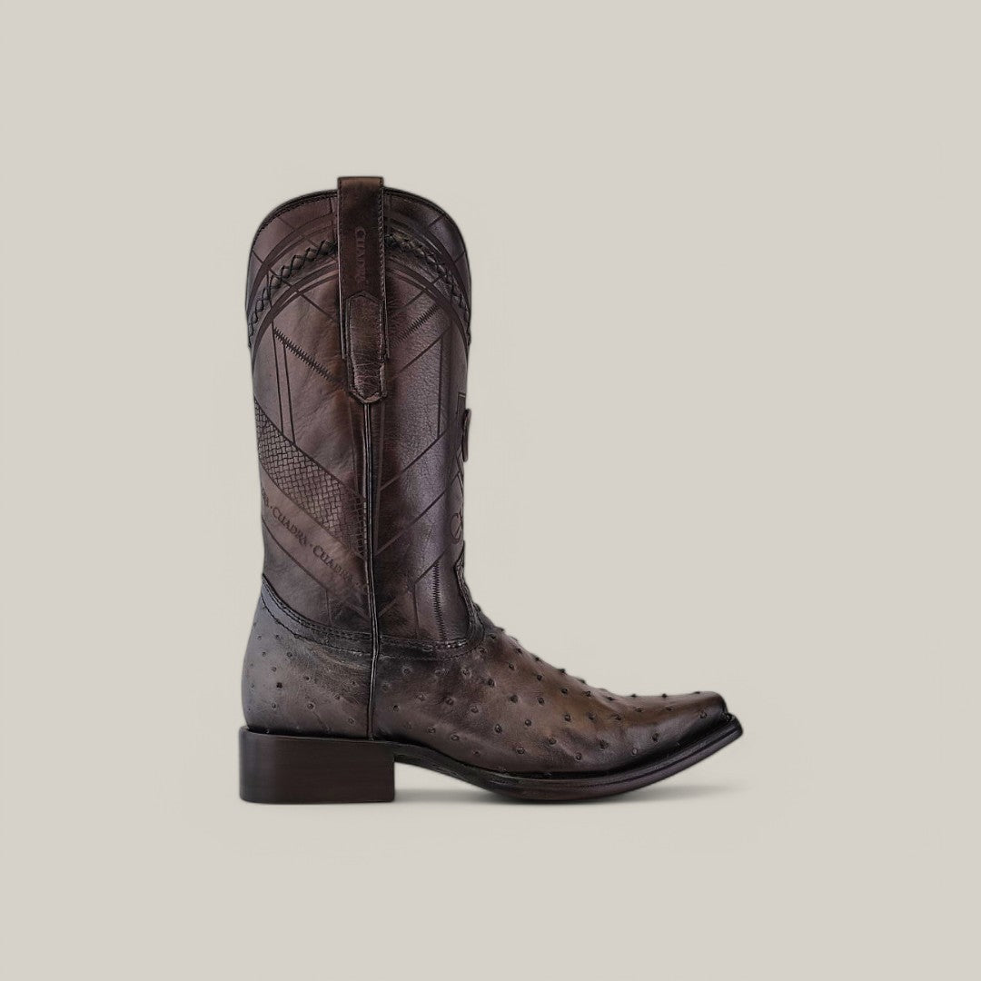 A single Everest Gray Ostrich cowboy boot (CU603) with laser-etched and woven design, narrow square toe, and stitch detailing, sits on a light beige background.