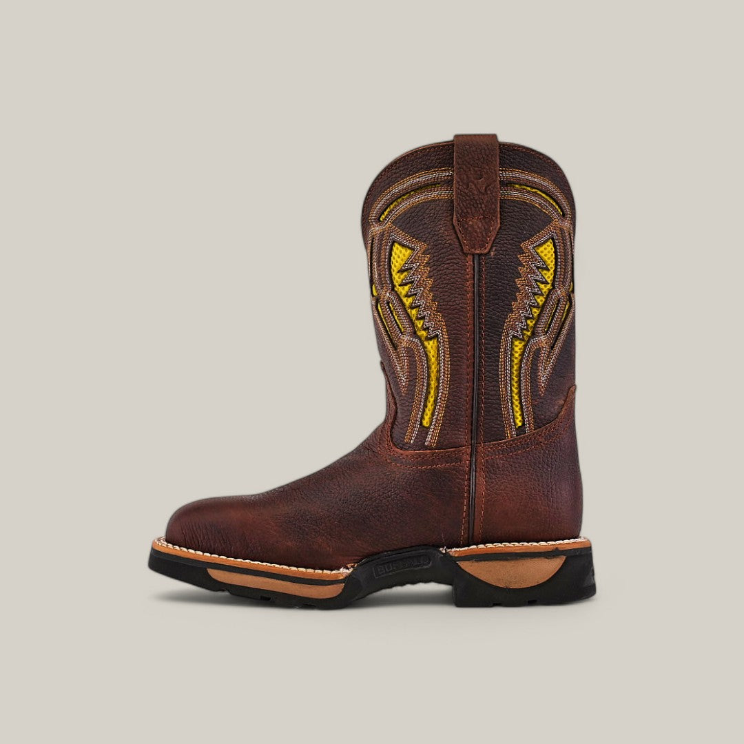 The Floter Brown Soft Toe - E6187 cowboy boot, with intricate yellow stitching and a durable black sole, is displayed on a beige background. It features a top pull tab for easy wearing, offering both style and functionality.