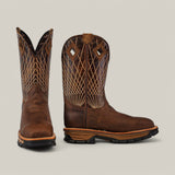 The Amazonas Tanger Soft Toe - E6257 boots feature intricate white stitching on brown leather. One boot is upright, revealing the side view, and the other shows its front. They have dark soles, slightly pointed toes, and are displayed against a plain light gray background for an elegant look.