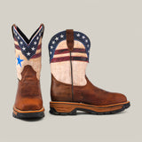 The Aventajado Penac Composite Toe - E6282 features two cowboy boots with stars and stripes, capturing the Texas Country spirit. One boot highlights a blue star on white with red and blue details; the other displays the full patriotic design. Crafted in brown leather, these durable boots embody rugged charm.