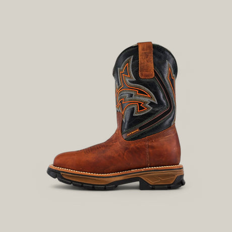 The Amazonas Honey Soft Toe - E6002 is a brown leather cowboy boot with a black and orange patterned upper, known for Texas Country Work Boots durability. It includes a sturdy sole and pull tab for easy wear, set against a plain light gray backdrop.