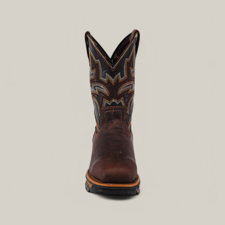 A front view of one Amazonas Chocolate Soft Toe - E6002 boot showcases intricate shaft stitching. This durable, comfortable boot has a rounded toe and rugged sole, placed against a simple light gray background.