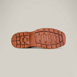 The image features the sole of a Crazy Tang Soft Toe - E6015 boot, reflecting Texas Country Work Boots style with rectangular and square tread patterns on a light gray background.